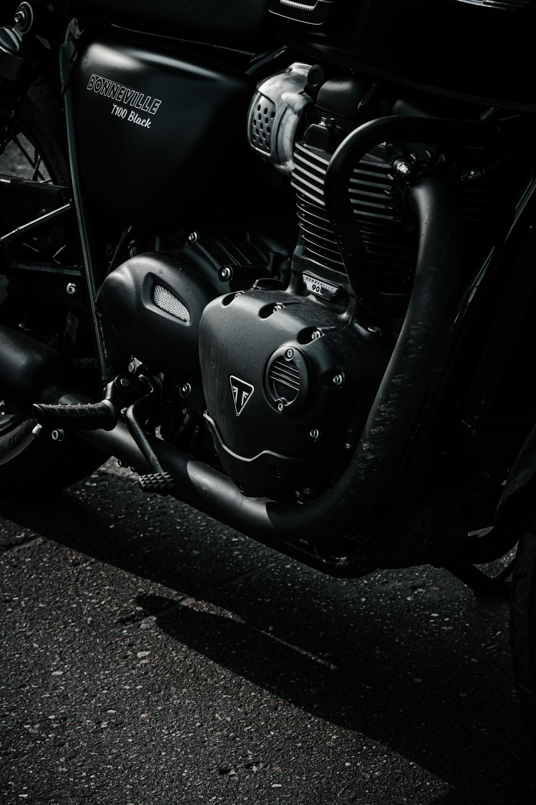 black motorcycle on gray concrete road