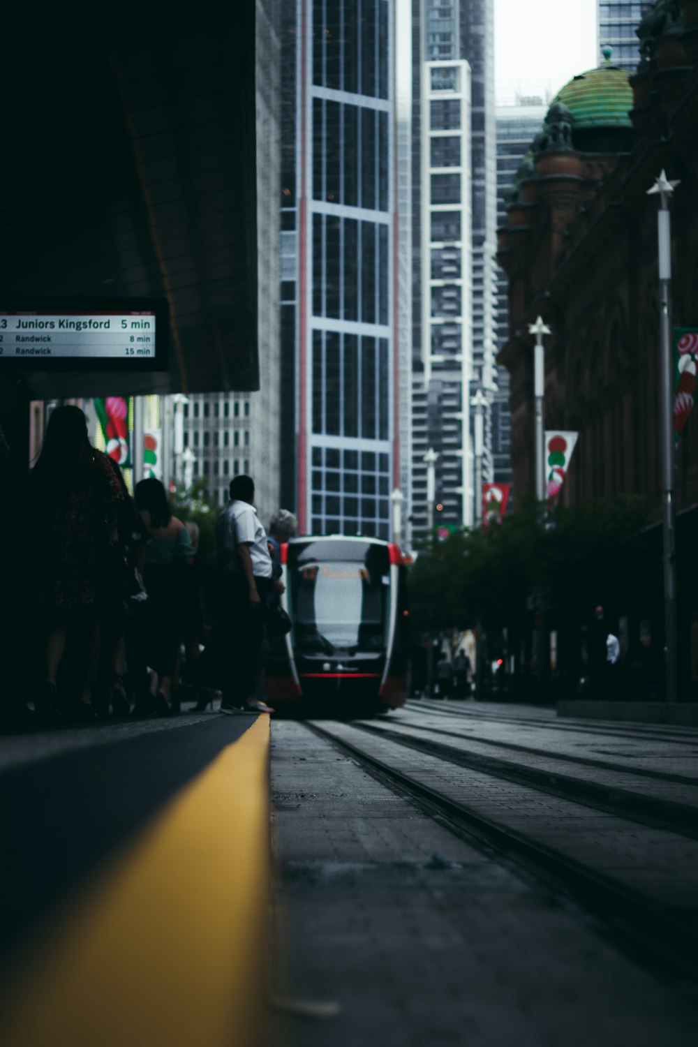 people walking on street near buildings during daytime