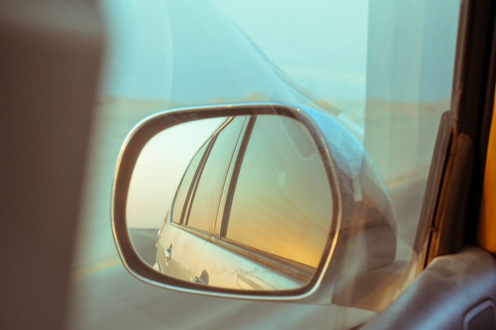 car side mirror with water droplets