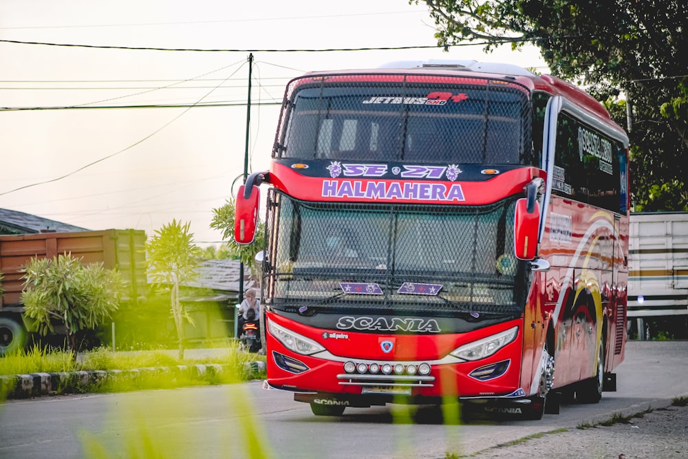 red and black truck on road during daytime