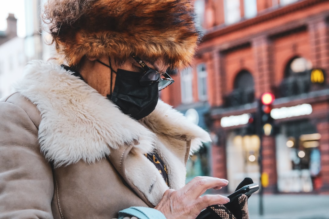 woman in brown fur coat and black sunglasses