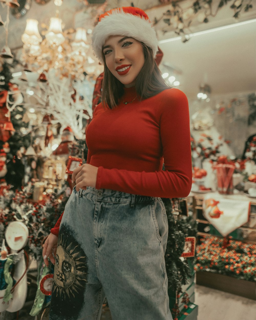 woman in red long sleeve shirt and blue denim jeans