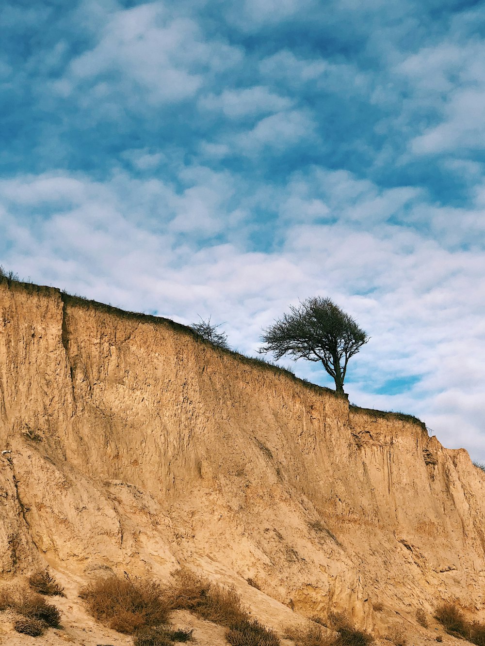 brown rock formation under blue sky during daytime