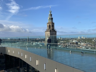 Traveler enjoying a panoramic cityscape from a rooftop terrace
