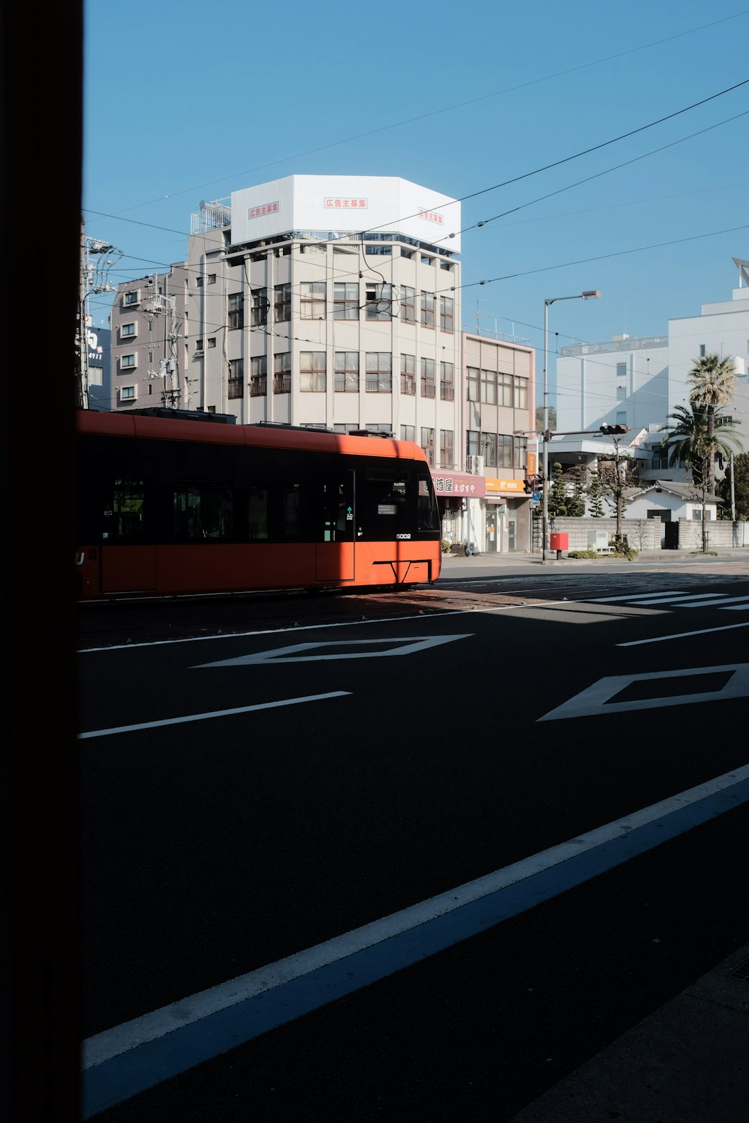 red and yellow tram on road during daytime