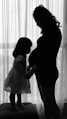 woman in white dress standing beside woman in black dress