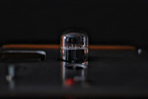 An artistic shot of vacuum tubes arranged in a pattern, highlighting their glass shapes.