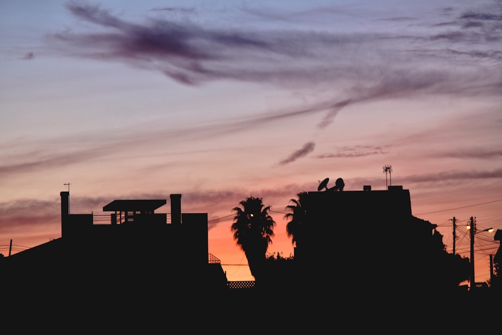 silhouette of building during sunset