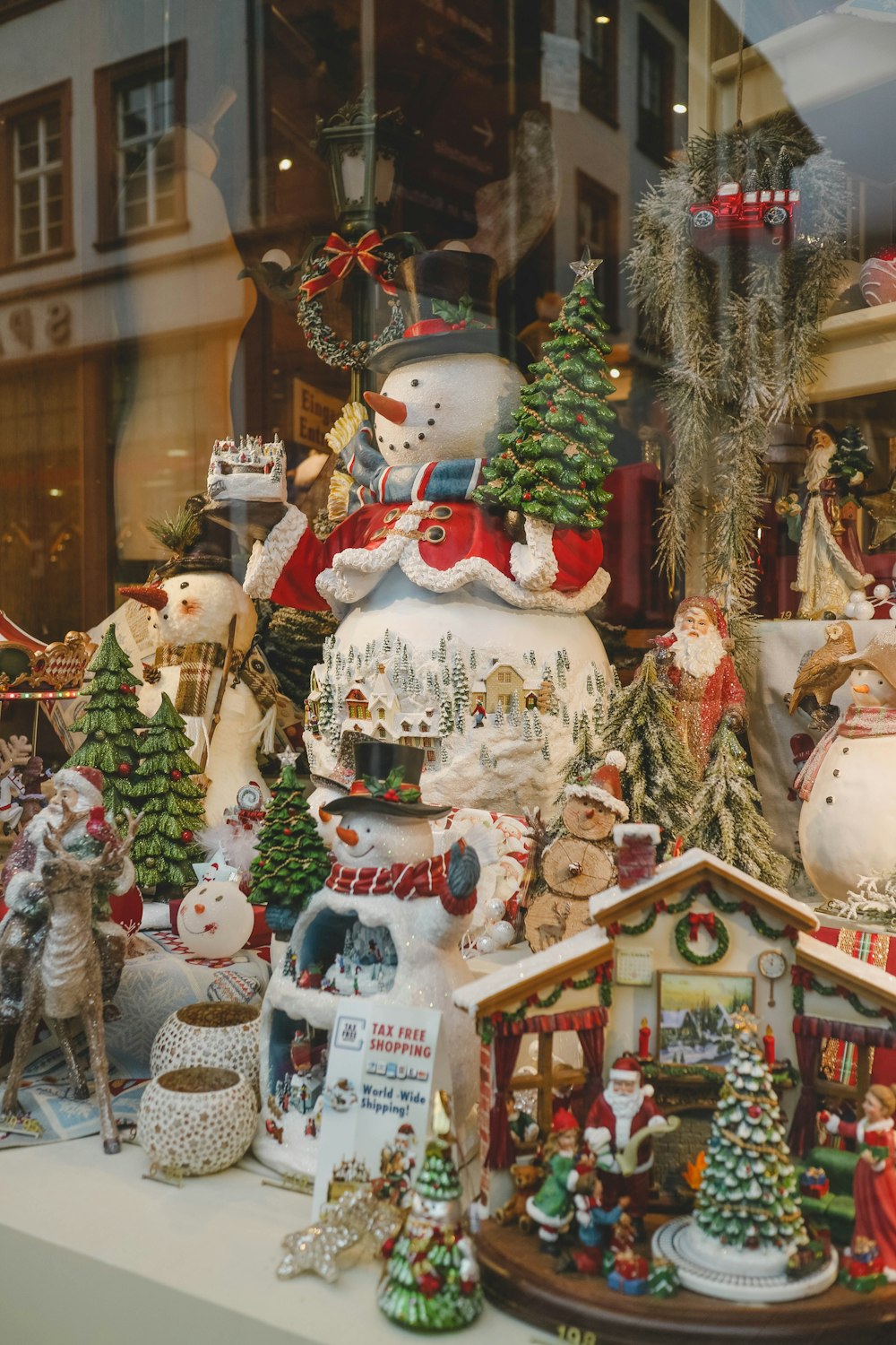 white red and green ceramic snowman figurine