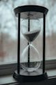 clear hour glass on table