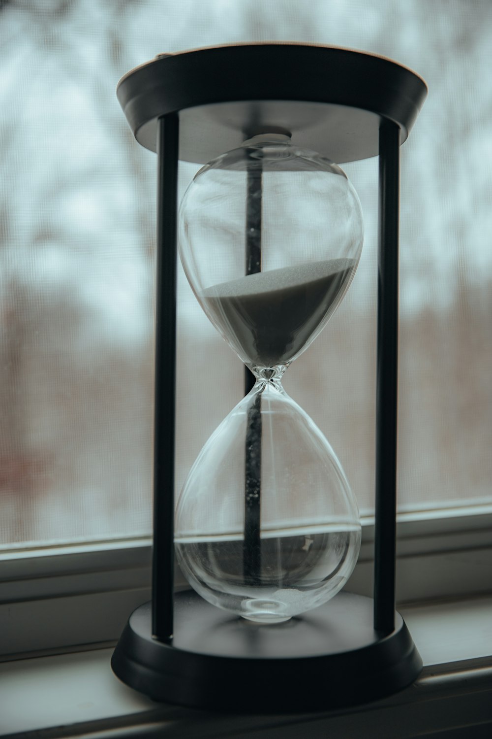 clear hour glass on table