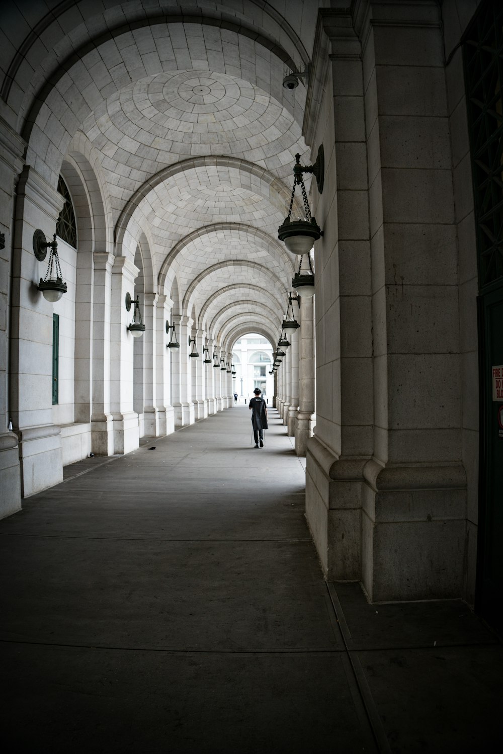 person walking on hallway during daytime