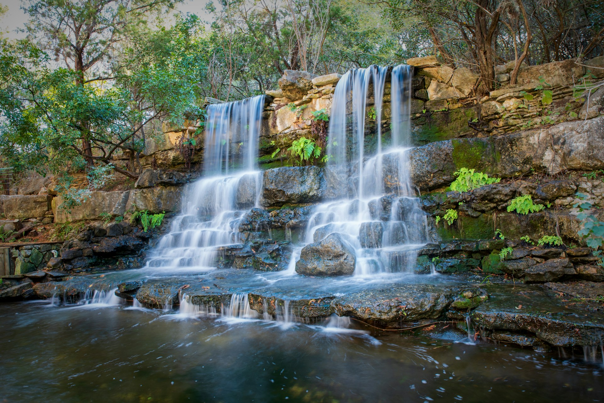 waterfalls in the middle of the forest