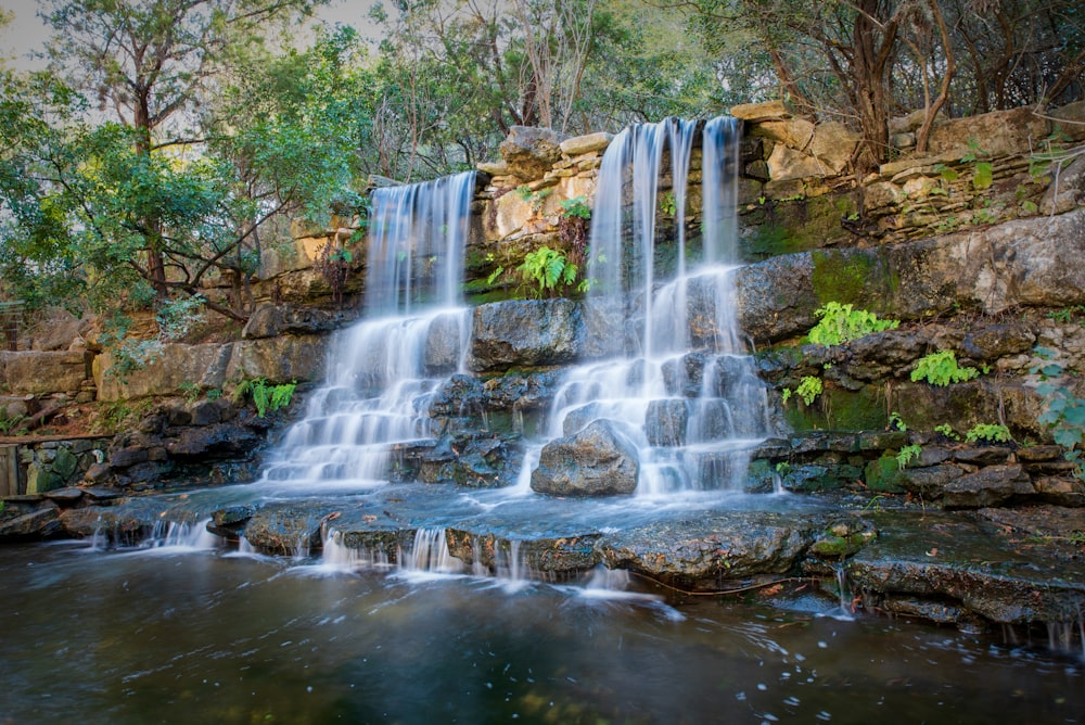 waterfalls in the middle of the forest