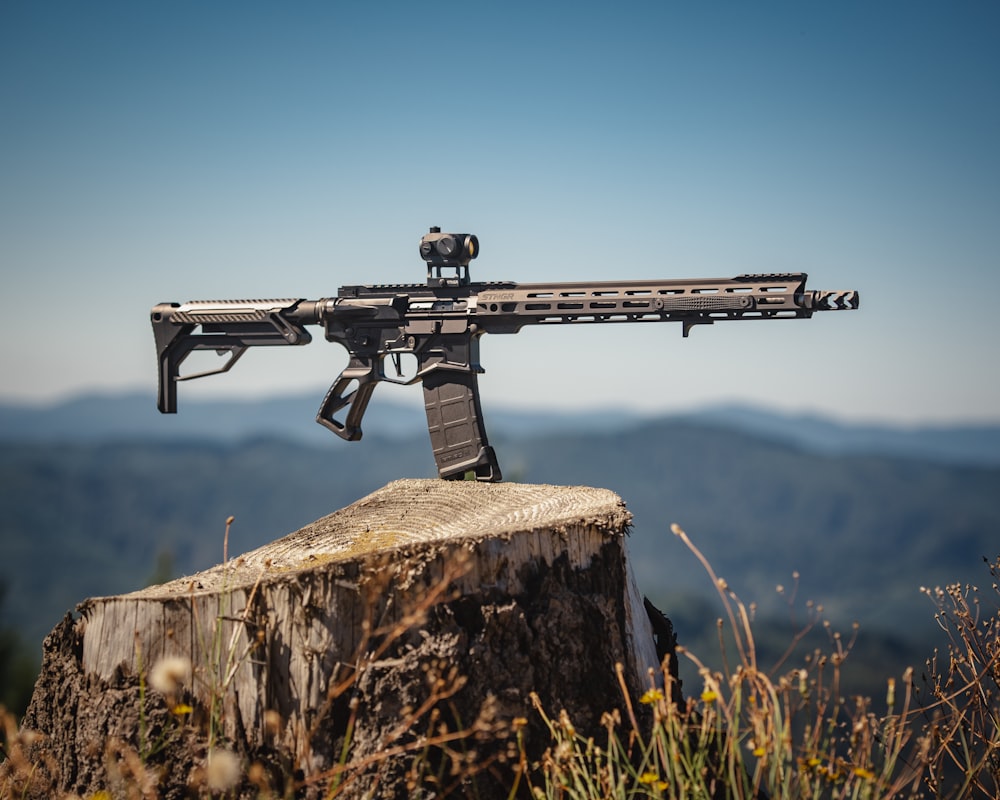 black rifle on brown rock