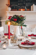 Decorative vases and table runners arranged on a festive dining table.