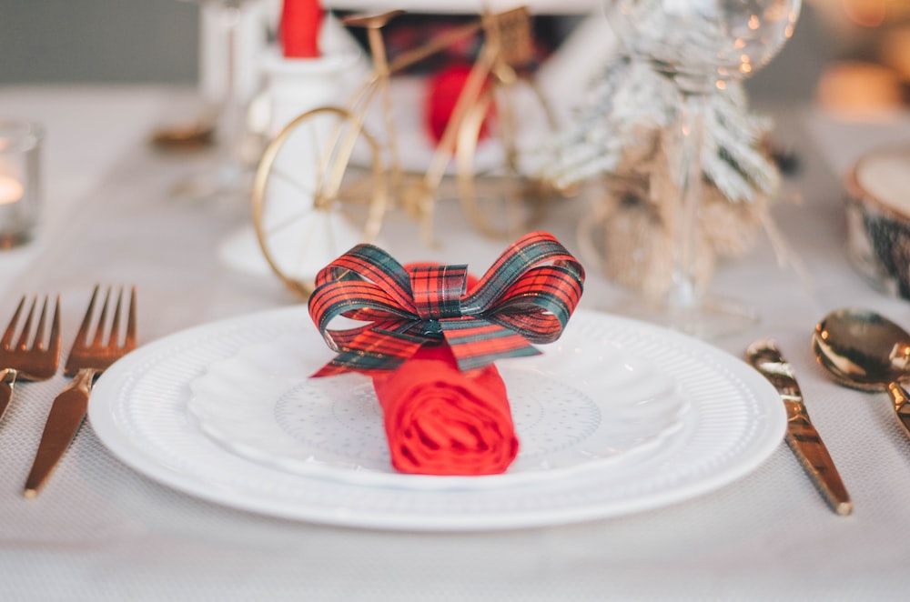 red and blue ribbon on white round plate