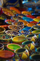 A set of handmade ceramic bowls in vibrant colors.