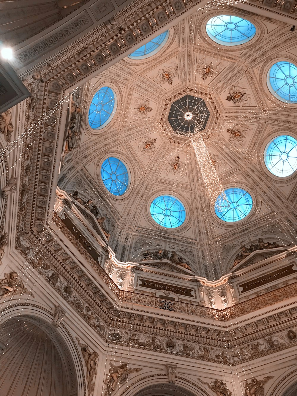 low angle photography of white and blue ceiling