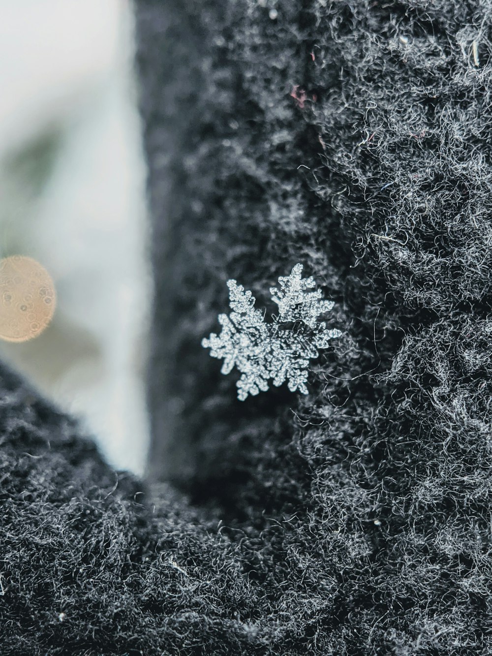 snow flakes on black and white textile