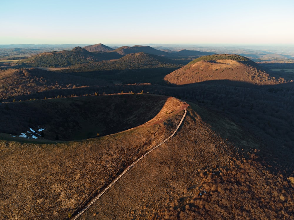 aerial view of road between mountains during daytime