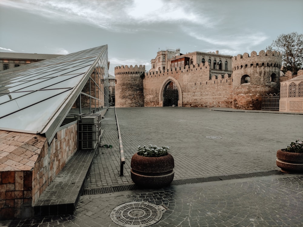 brown brick building under gray sky