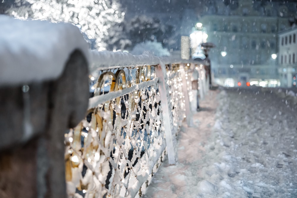 snow covered fence during daytime