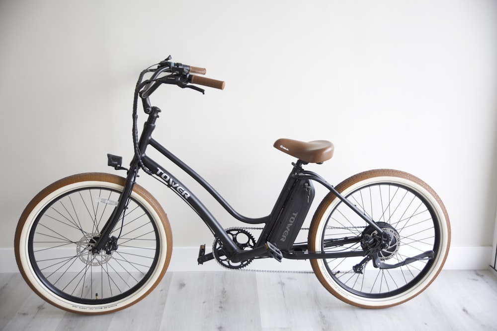 black and brown bicycle on white floor