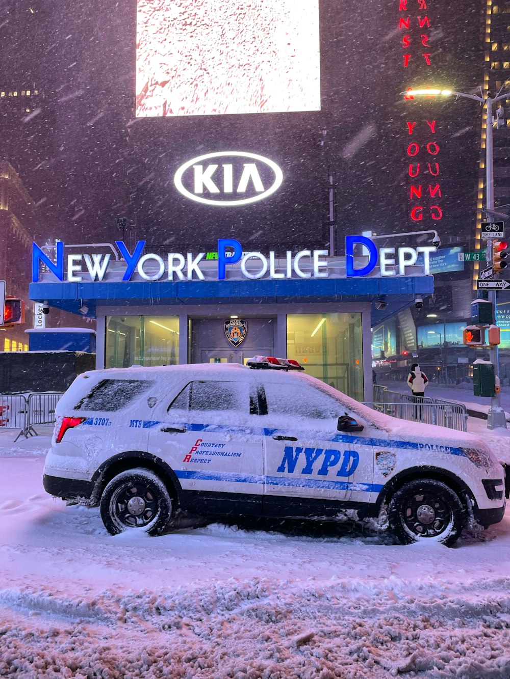 white and blue suv on road during daytime