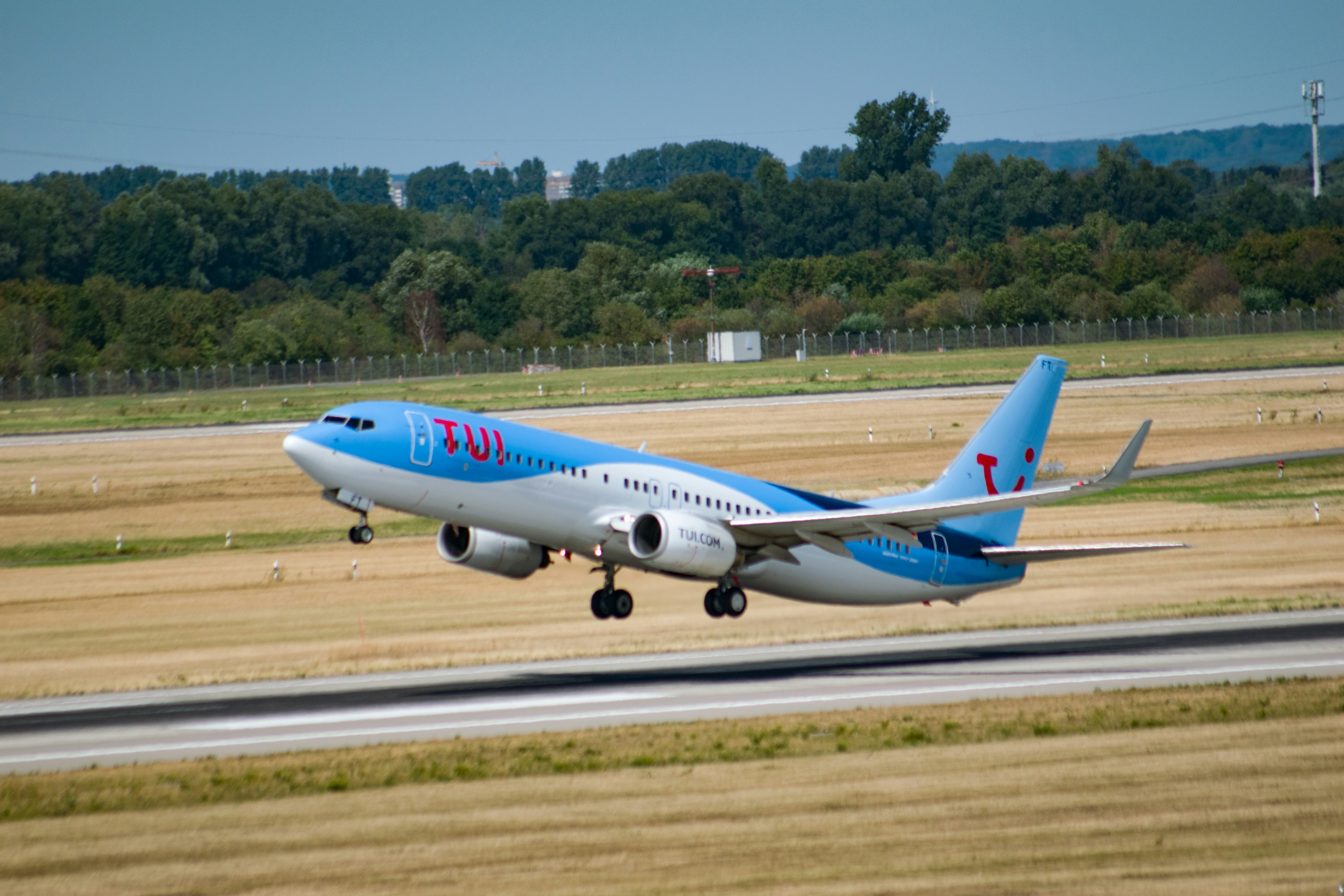 white and blue passenger plane on airport during daytime, 
