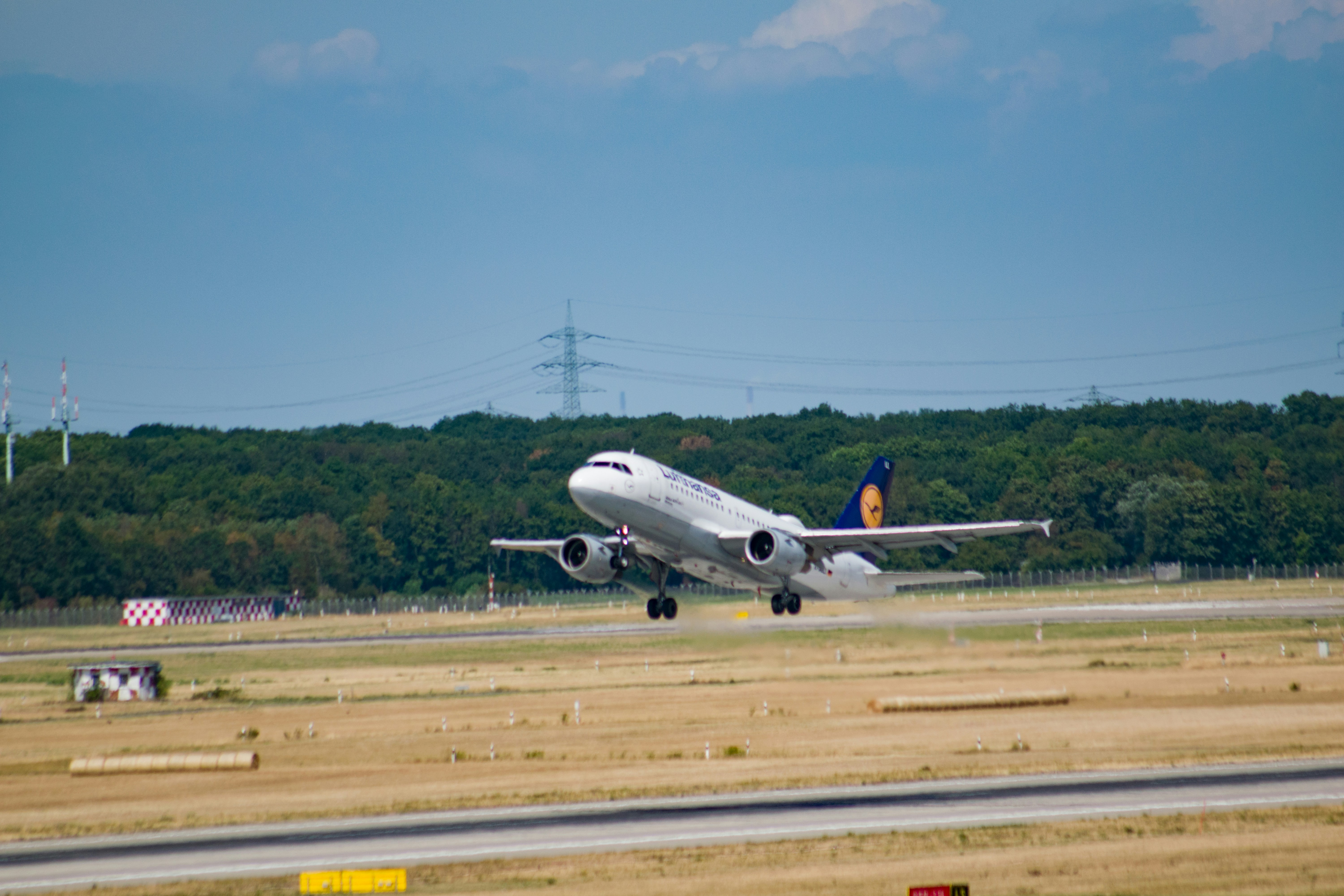 white and red airplane on airport during daytime, 