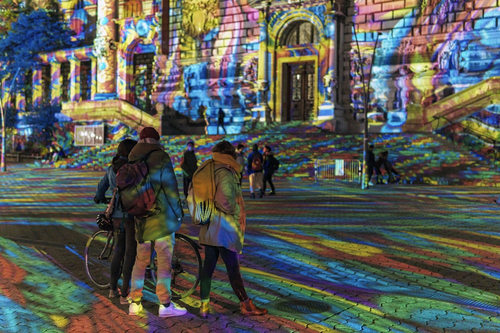 people walking on street during nighttime