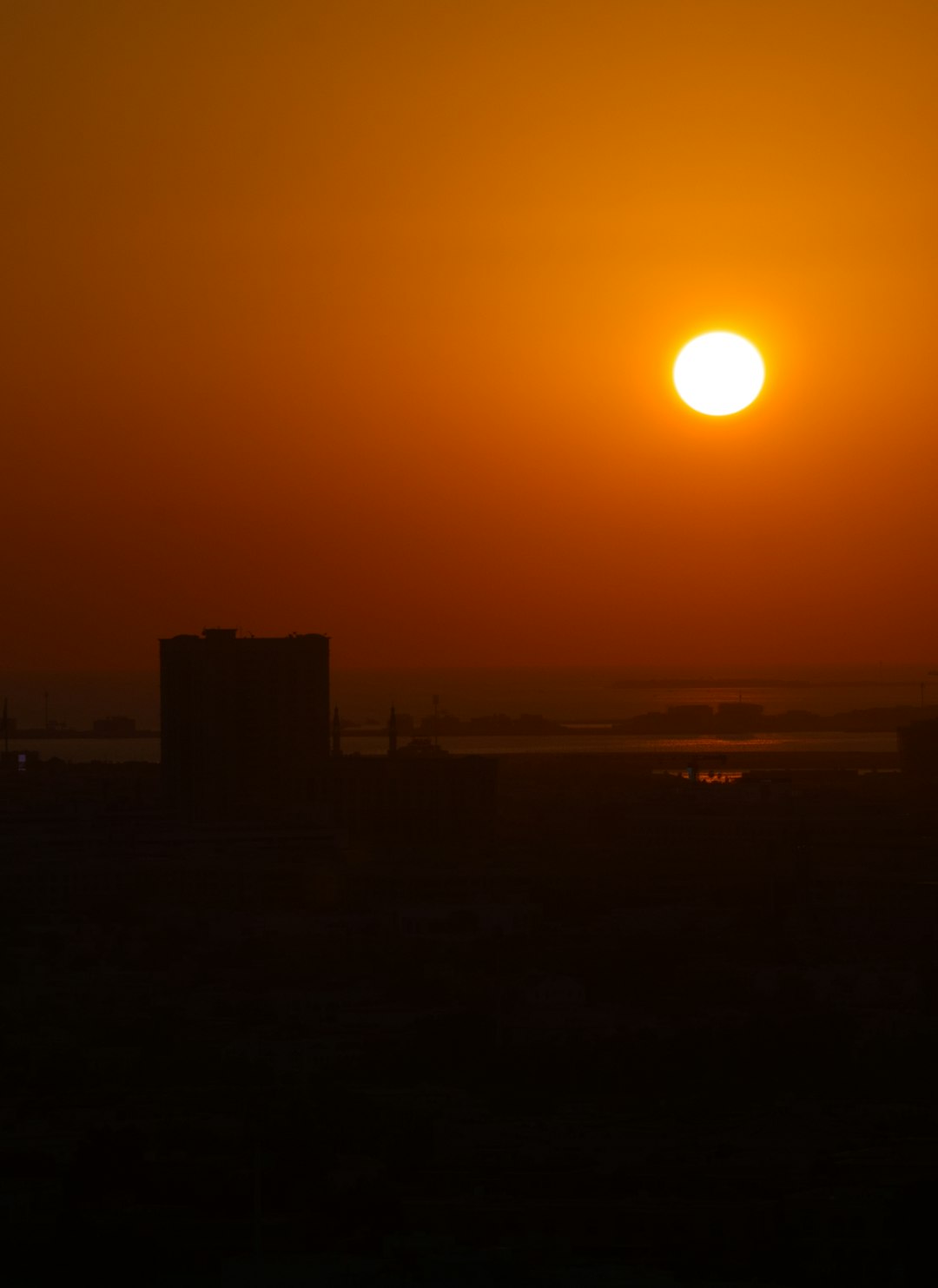 silhouette of building during sunset