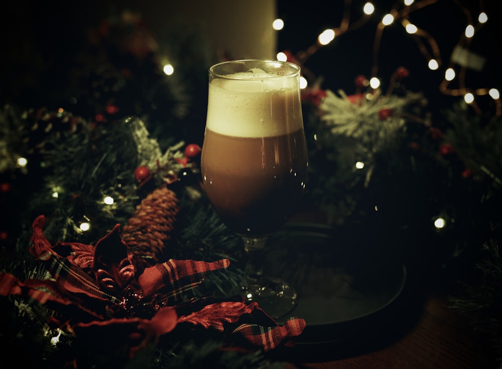 clear drinking glass with brown liquid