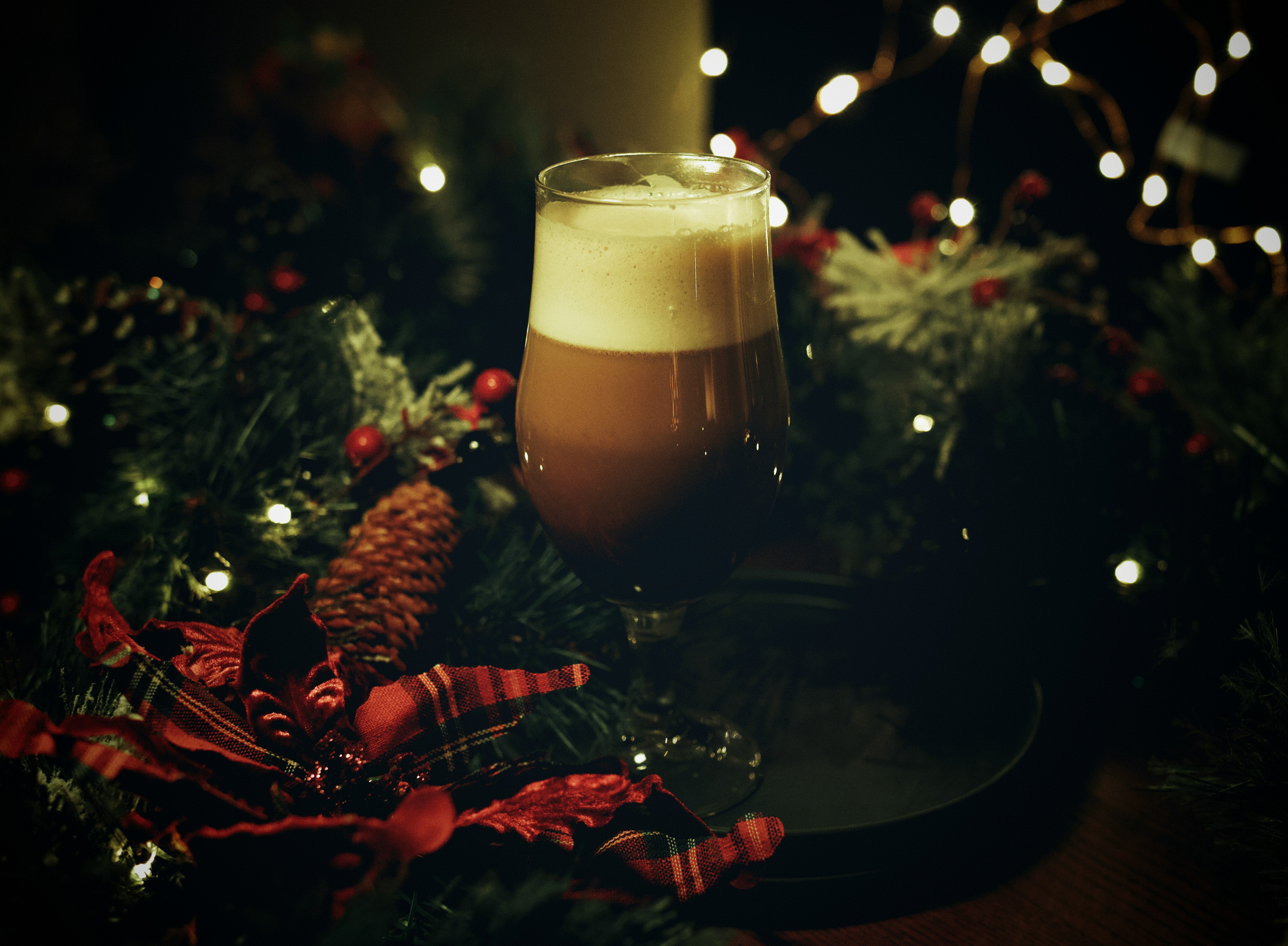 clear drinking glass with brown liquid