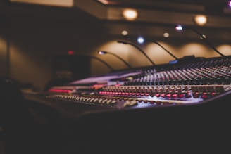 a sound mixing console in a recording studio