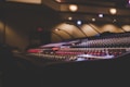 a sound mixing console in a recording studio