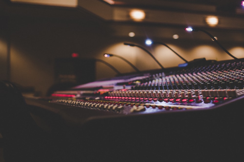 a sound mixing console in a recording studio