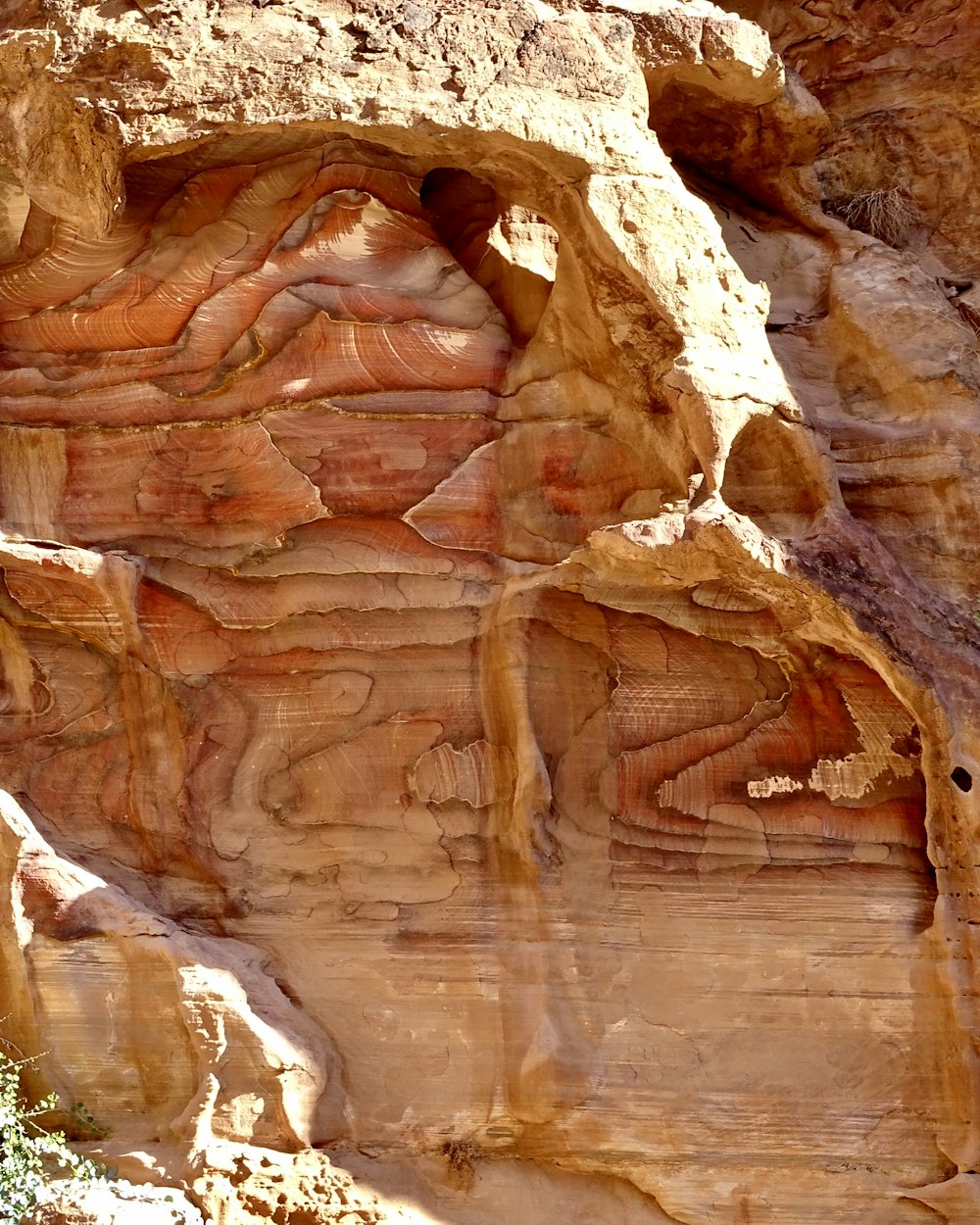 a rock face carved into the side of a mountain