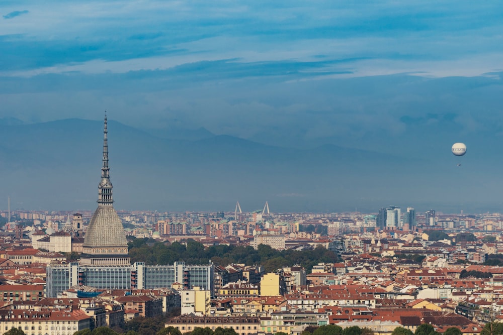 aerial view of city buildings under cloudy sky during daytime