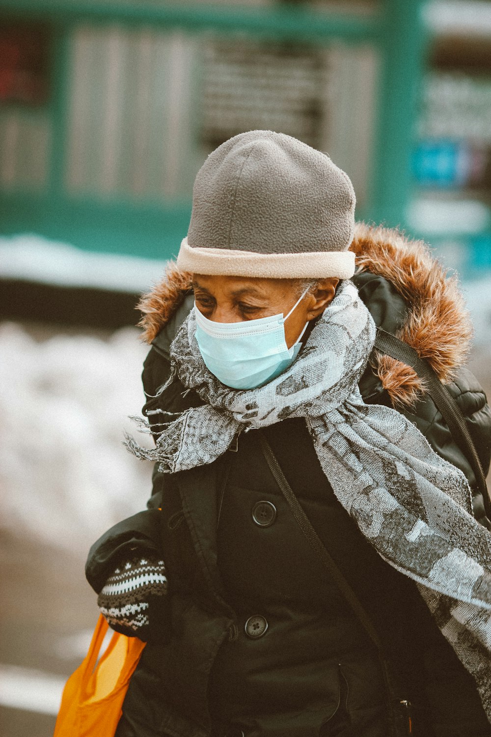 woman in black and white scarf and black jacket