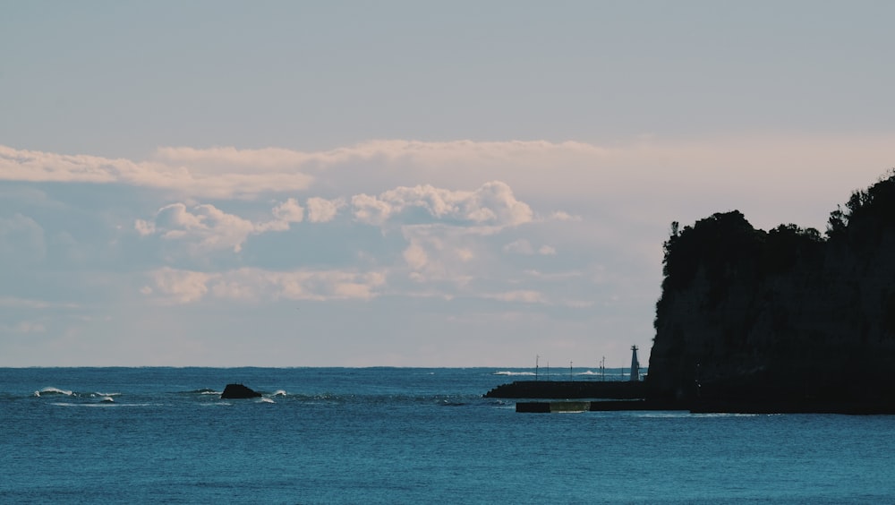 silhouette of trees on island during daytime