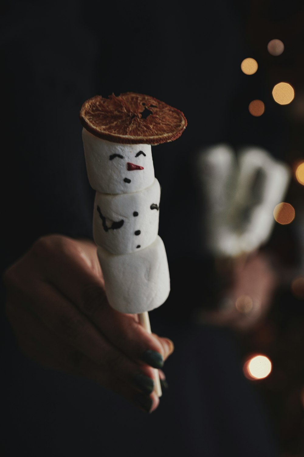 person holding white ceramic mug with brown coffee