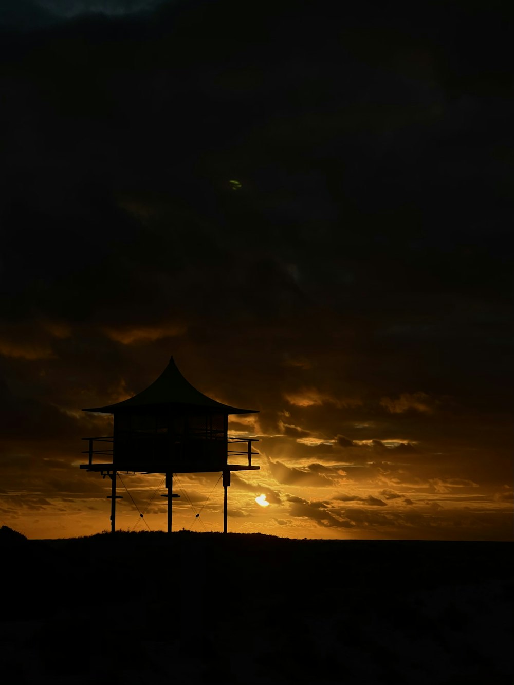 silhouette of pyramid during sunset