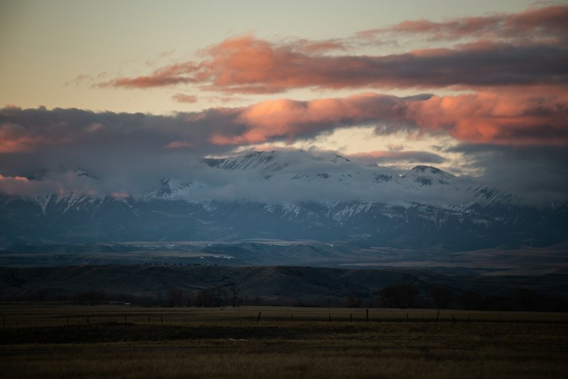 Sunset over snow-capped mountains from the Gallatin Valley
