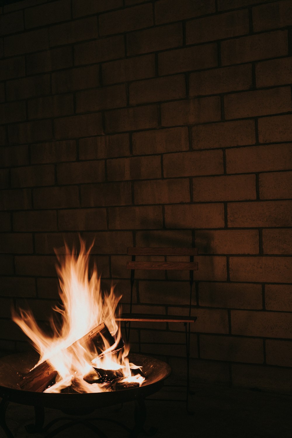 fire in brown brick wall