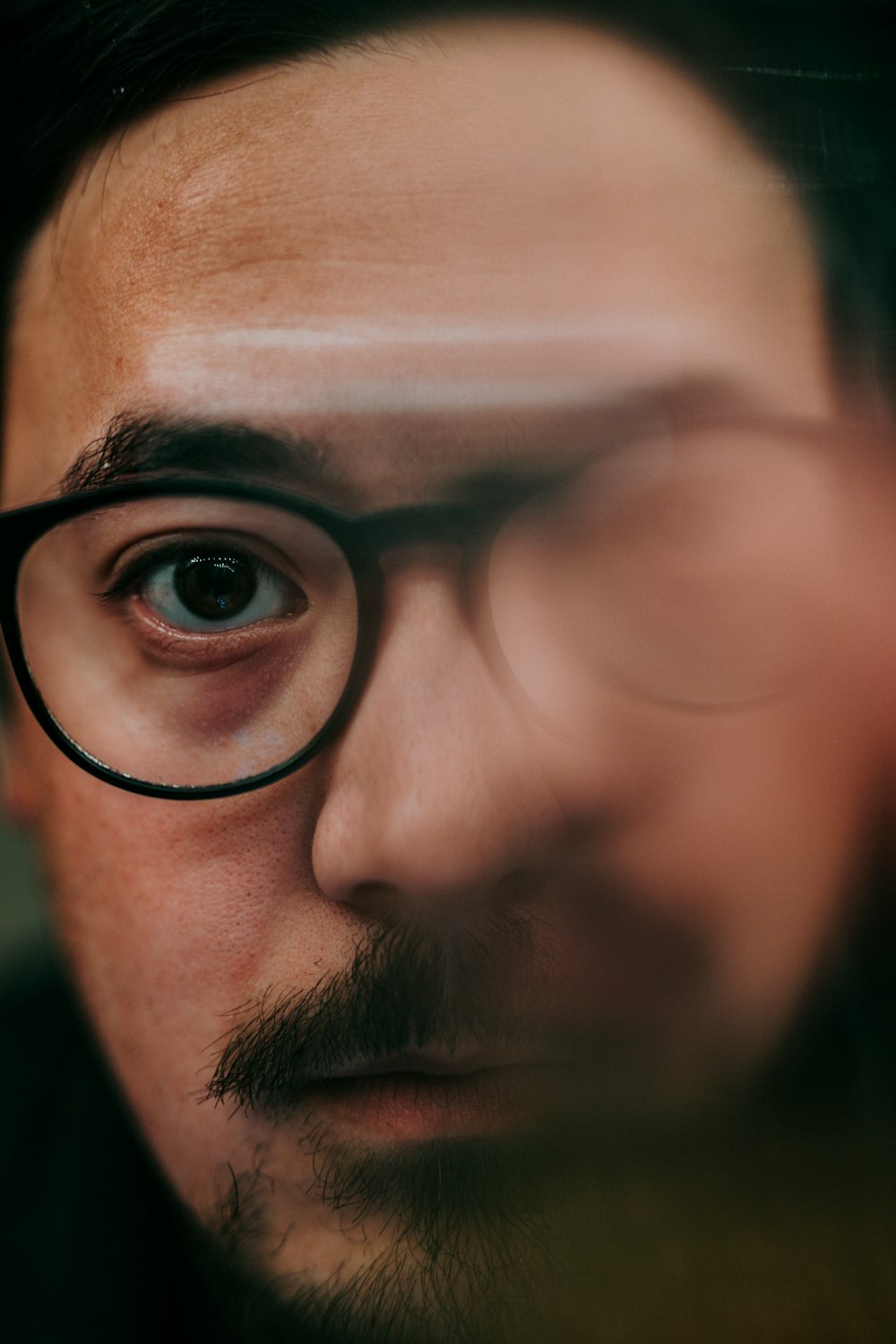 man in black framed eyeglasses