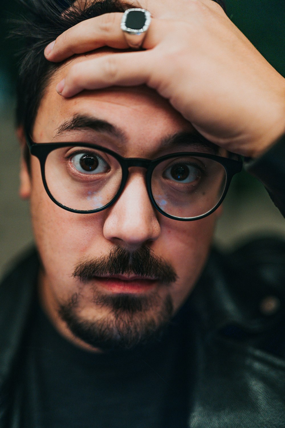 man in black framed eyeglasses