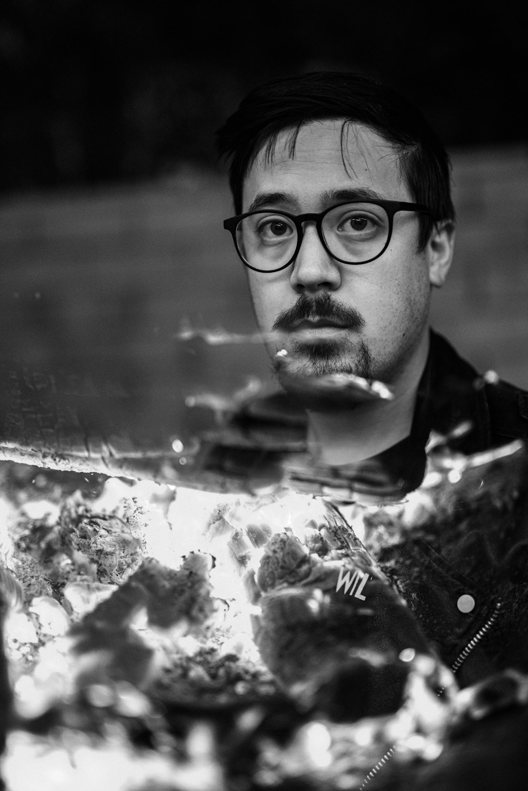 grayscale photo of man wearing eyeglasses