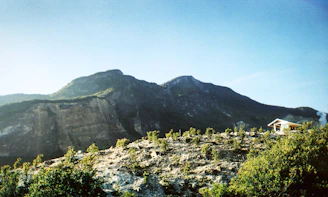 Open land plot with mountain views and clear blue sky